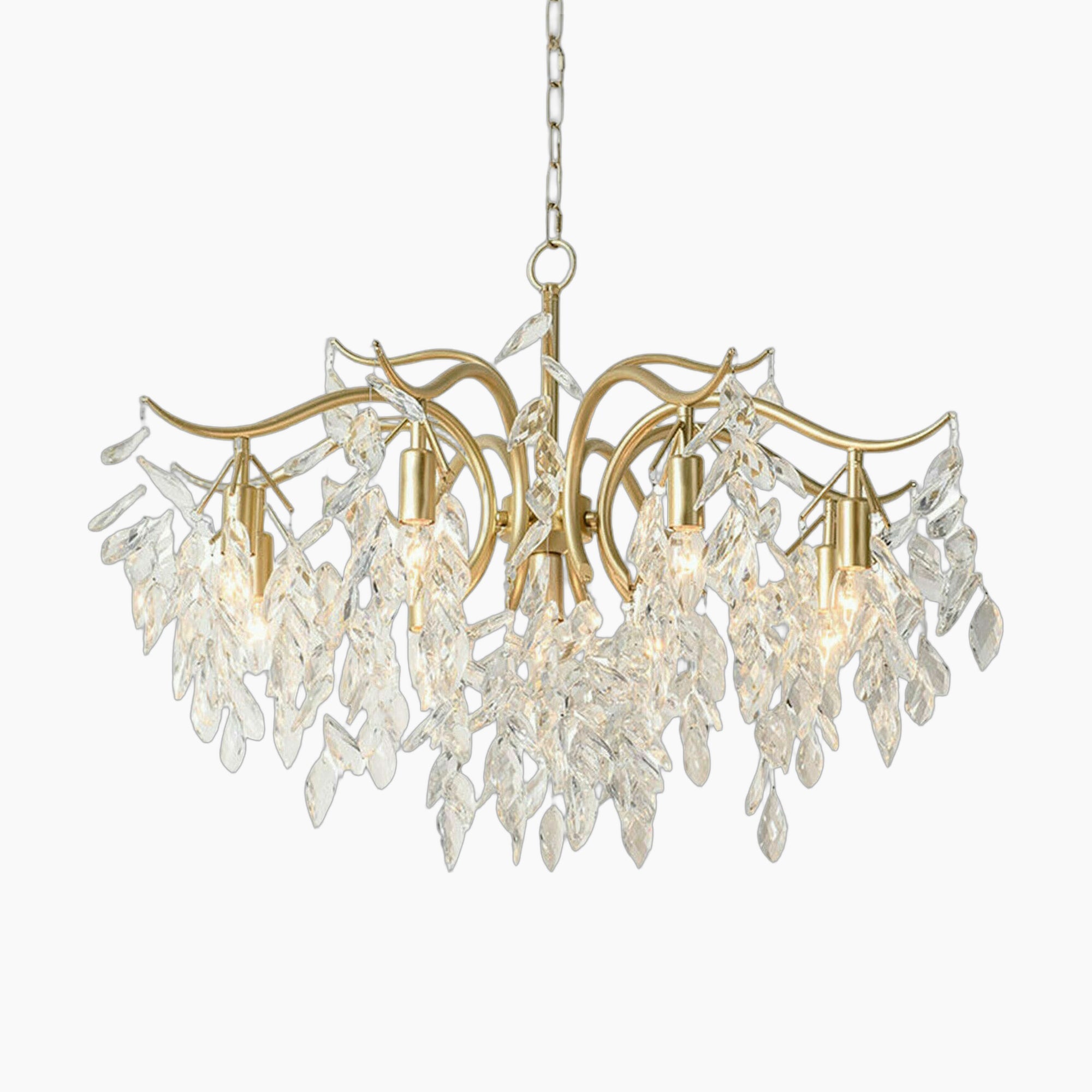 Maison Ornate 8-arm gold chandelier with curved arms, crystal leaves, and visible E12 bulbs.