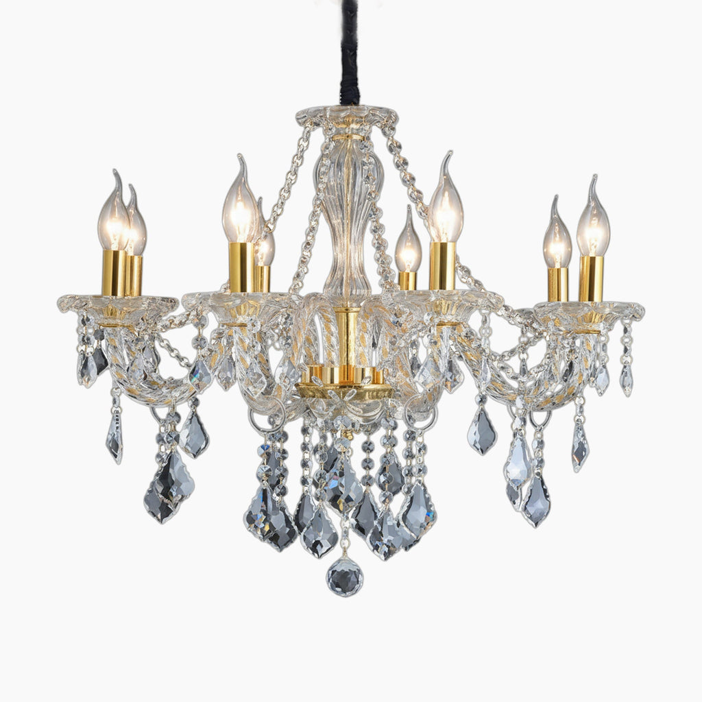 Ornate gold chandelier with maple leaf accents, six candles, and luxurious dangling K9 crystals.