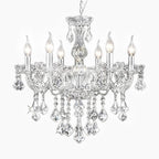 A modern crystal chandelier with six candle bulbs, silver accents, clear K9 crystals, adjustable chain.