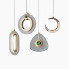 Maison Ornate Art Deco chandelier with four gold and crystal pendant shapes suspended on wires.