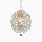 Round 3-light gold chandelier with clear crystal drops, ornate detailing, and sparkling metal-and-crystal design.