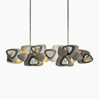 Modern crystal chandelier with LED lights, dual rows of clock-faced triangular shades, sleek vertical rods.