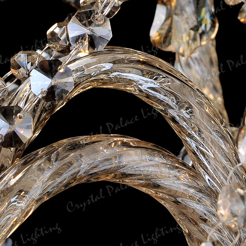 Close-up of Maison Ornate’s K9 Crystal Champagne Chandelier, twisted glass arms and crystal accents gleaming.