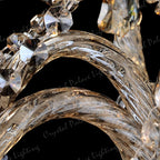 Close-up of Maison Ornate’s K9 Crystal Champagne Chandelier, twisted glass arms and crystal accents gleaming.