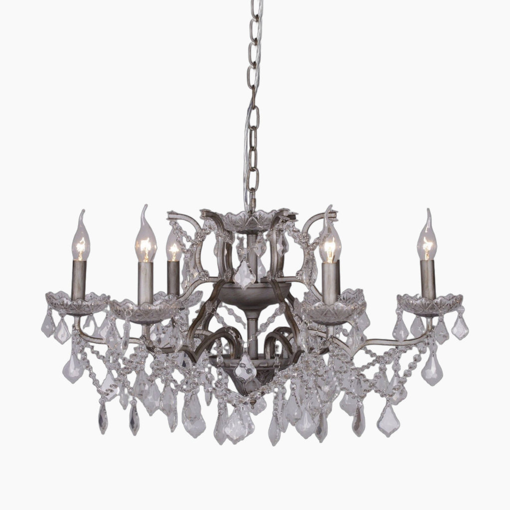 Elegant French crystal chandelier with six silver glass arms, candle bulbs, and faceted crystal drops.