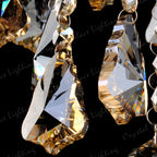 Maison Ornate K9 Crystal Champagne Chandelier with faceted crystals and gold accents reflecting light.
