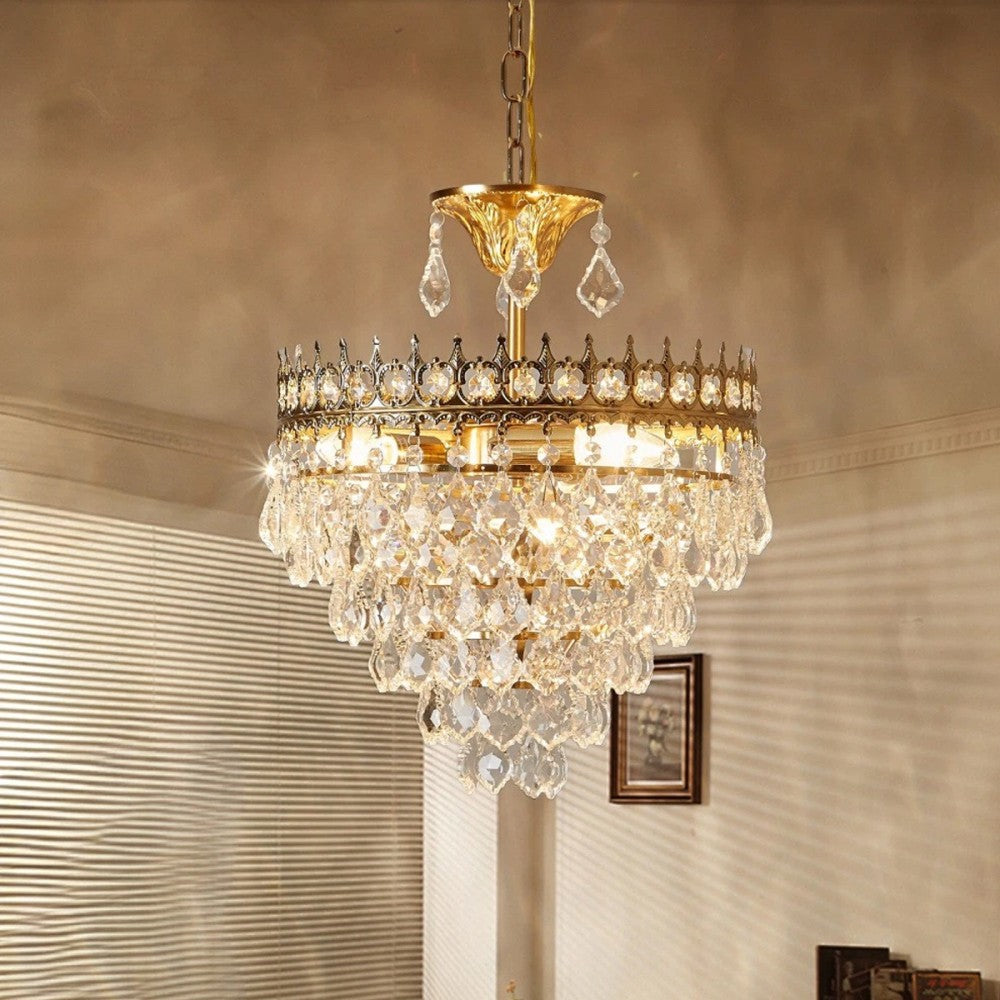 Maison Ornate chandelier with luxurious gold accents and radiant crystal drops, ceiling-mounted elegance.