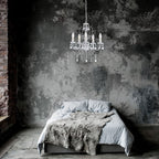 Maison Ornate Elegant Crystal Chandelier in classic white metal design, sparkling crystals, overhead lighting.