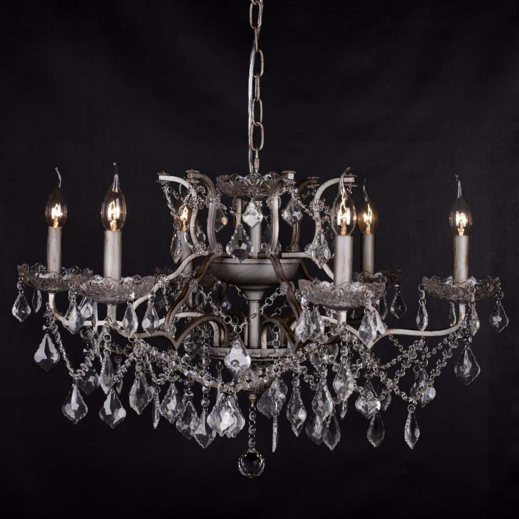 Six-arm silver crystal chandelier with clear prisms and beads in elegant French style.