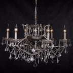 Six-arm silver crystal chandelier with clear prisms and beads in elegant French style.