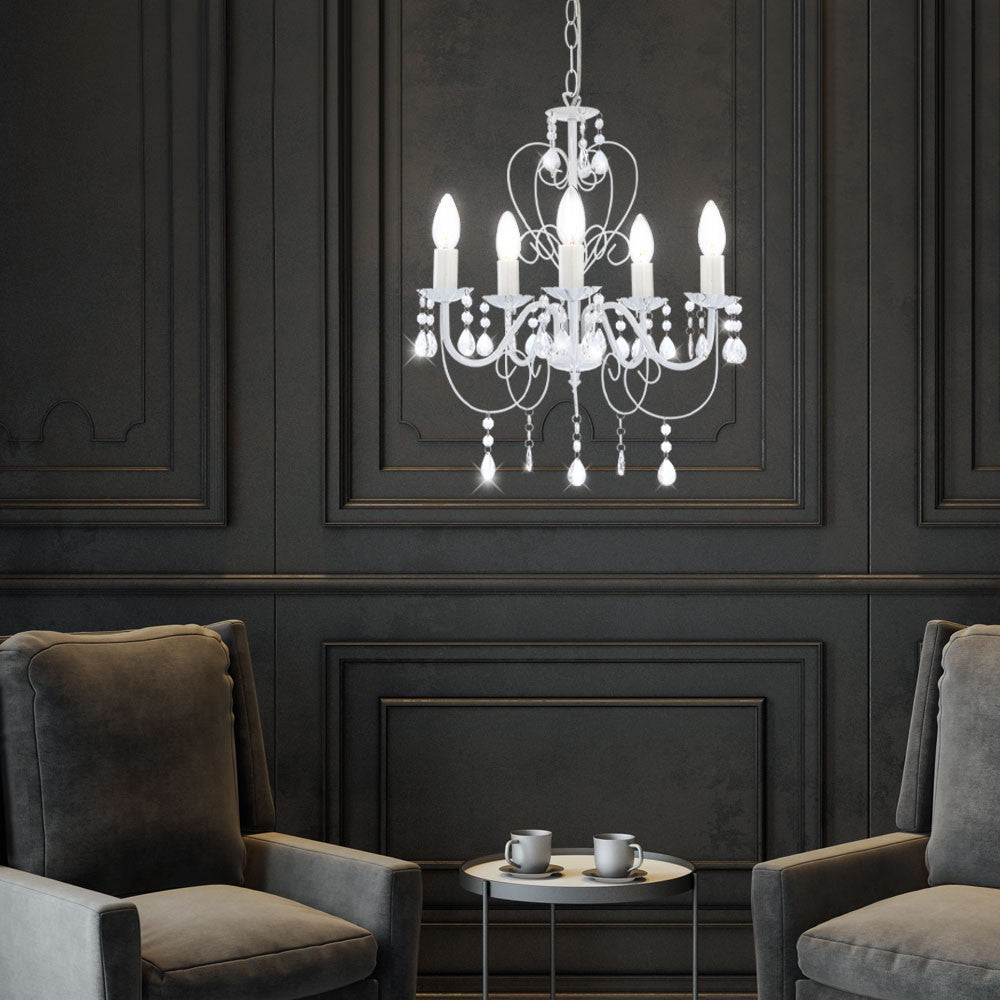 Maison Ornate Elegant Crystal Chandelier in white metal with classic design, softly glowing overhead.