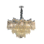 Chrome-finished chandelier with dimmable tiers of crystal prisms for elegant, industrial lighting.