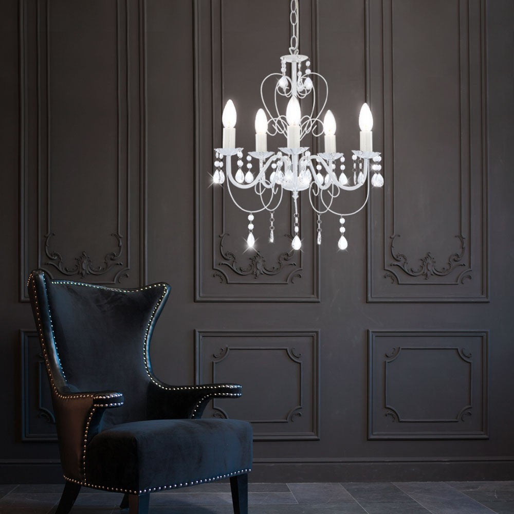 Maison Ornate Elegant Crystal Chandelier with classic white metal and crystal accents hanging gracefully.