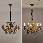 Pair of Maison ornate antique crystal chandeliers, 12-arm brass structures; left unlit, right illuminated.