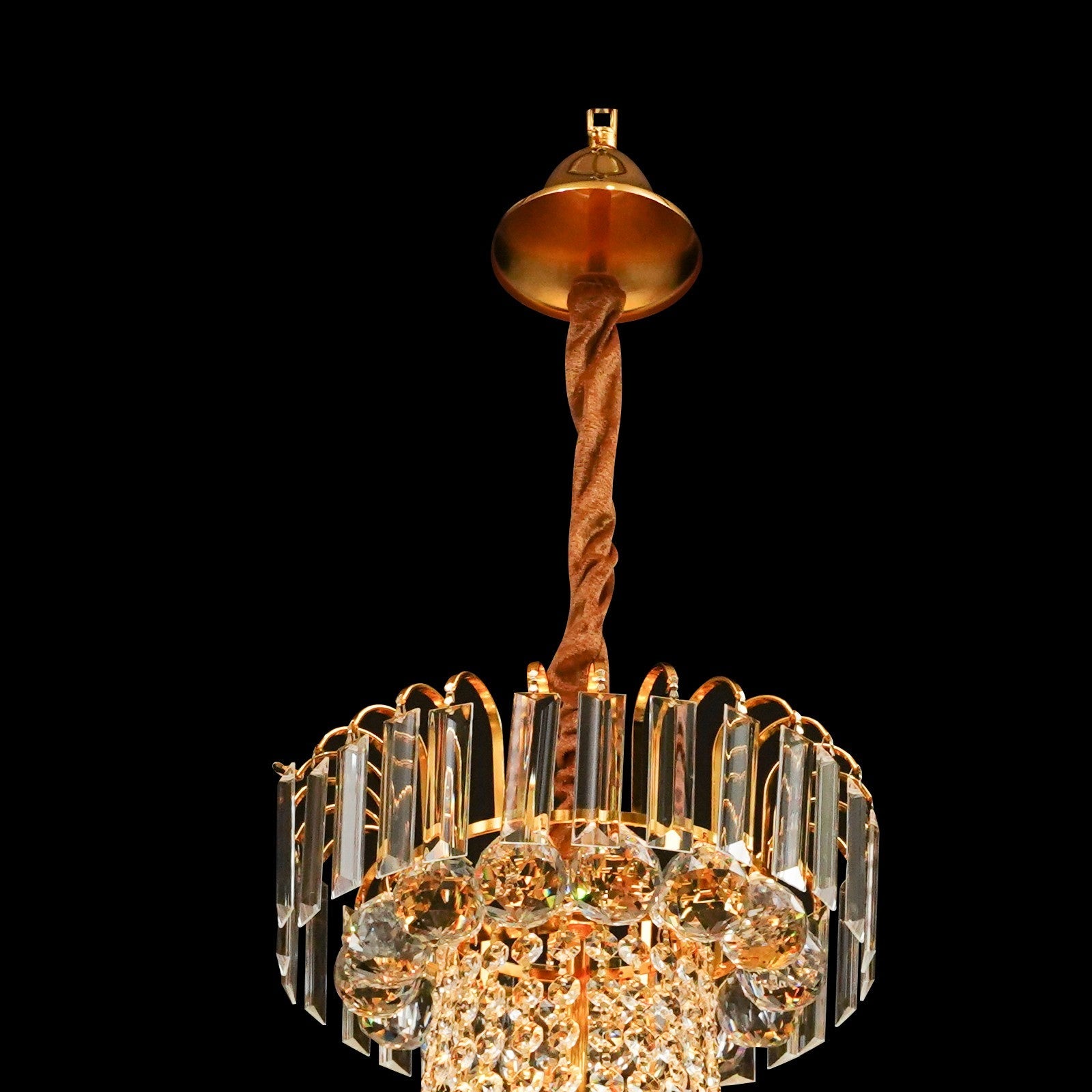 Empire Style Maison Ornate gold tassel crystal chandelier with glass prisms and sparkling crystals.