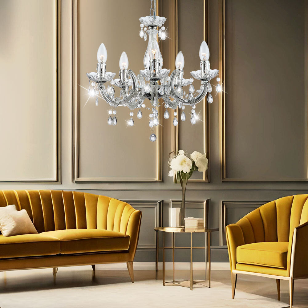 Maison Ornate’s Elegant Five-Arm Crystal Hanging Light in chrome, sparkling gracefully overhead.