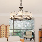 A round crystal chandelier and Maison Ornate Black Metal Multi-Pendant Crystal Chandelier displayed together.