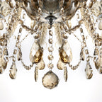 Maison Ornate Crystal Chandelier with 10 arms, gold-toned faceted crystals and elegant metal structure.