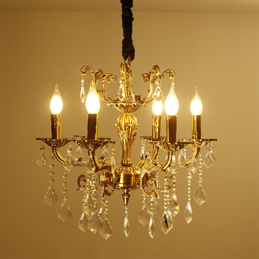 Maison Ornate Antique Crystal Chandelier features 12 brass arms with hanging crystal ornaments.