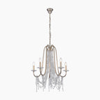 Elegant gold metal chandelier with six candle bulbs and crystal beads, hanging by adjustable chain.