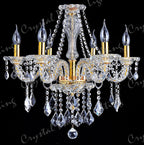 Ornate gold chandelier with maple leaf accents, six candle bulbs, twisted arms, and K9 crystal chains.