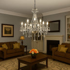 Maison Ornate Nine-Light Crystal Chandelier with chrome finish, elegant crystal arms and hanging pendants.