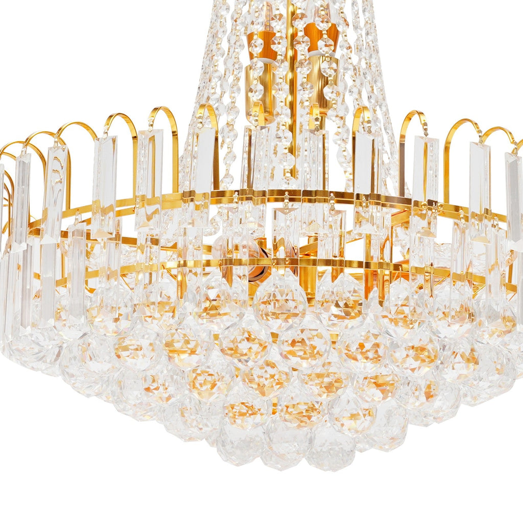 Close-up of Empire-style gold tassel crystal chandelier with circular prisms and droplets.