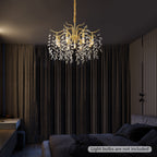 Maison Ornate Crystal Chandelier with gold branch design and crystal leaf accents, bulbs not included.