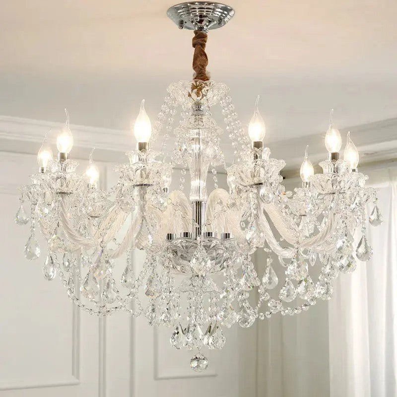 The Maison Ornate Elegant 6-Arm Crystal Chandelier features candle bulbs and sparkling crystal accents.