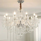 The Maison Ornate Elegant 6-Arm Crystal Chandelier features candle bulbs and sparkling crystal accents.