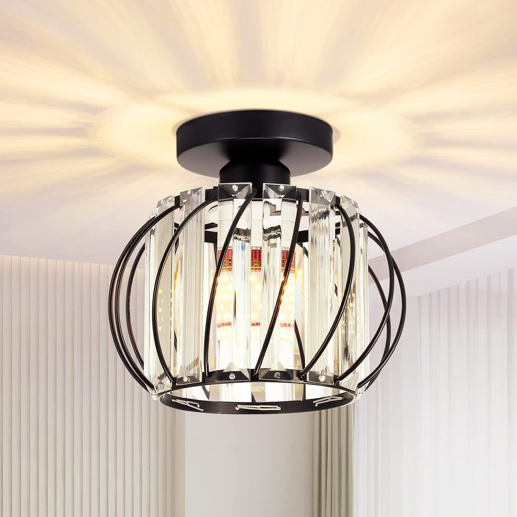 Ornate black metal and crystal mini pendant with vertical glass panels casts warm, decorative ceiling light.