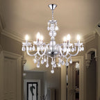 Maison Ornate Elegant Crystal Chandelier with chrome frame, silver tassels, and sparkling crystal droplets.