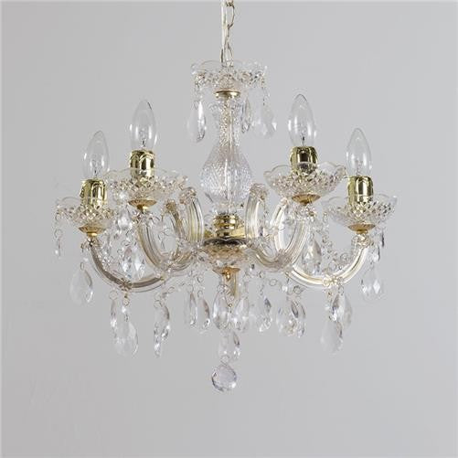 Five-arm chandelier with brass finish, acrylic accents, and hanging crystals, each arm holds candle-style bulb.