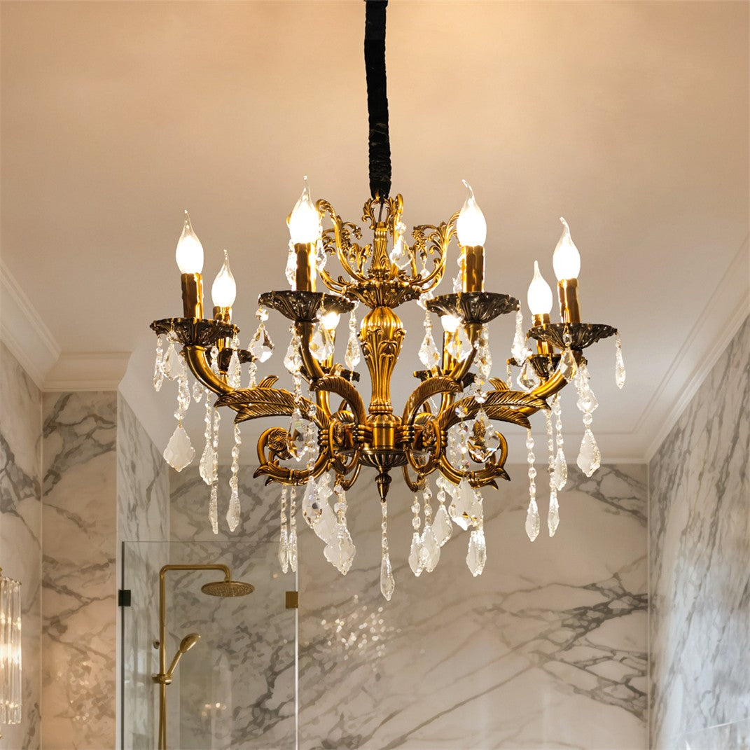 Maison Ornate Antique Crystal Chandelier with 12 brass arms, candle bulbs, and draped crystal ornaments.