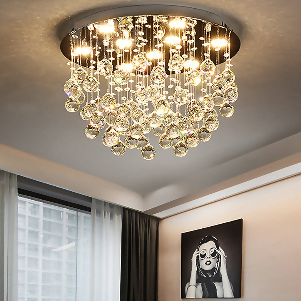 The Maison Ornate Round LED Crystal Ball Chandelier features nine lights and hanging K9 crystal droplets.