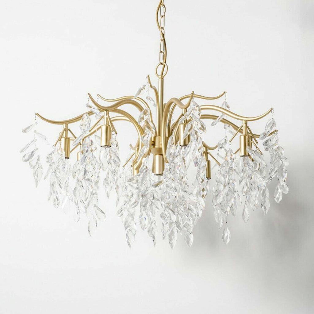 Elegant gold 8-arm chandelier with curved arms and K9 crystal leaves, modern refined design.