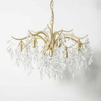 Elegant gold 8-arm chandelier with curved arms and K9 crystal leaves, modern refined design.