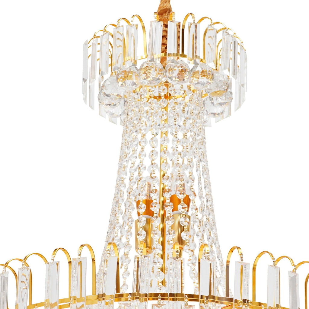 Ornate Empire-style chandelier with gold tassels, clear crystal prisms, and intricate detailing.