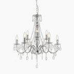 Maison Ornate Nine-Light Chandelier with chrome finish, clear crystal beads, and teardrop pendants.