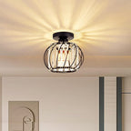 Maison Ornate Black Metal Crystal Mini Pendant with modern cage design and starburst light pattern.