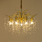 Modern gold branch chandelier with six bulbs, crystal accents, and elegant curved shimmering details.