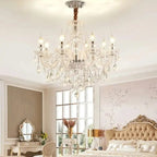 The Maison Ornate Elegant 6-Arm Crystal Chandelier features sparkling crystals and six curved arms.