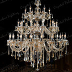 Maison Ornate K9 Crystal Champagne Multi-Arm Chandelier with candle bulbs, multi-tiers, and sparkling crystal adornments.