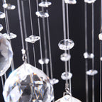 Close-up of Maison Ornate Crystal Ball Chandelier with chrome spiral, crystal beads, and pendants sparkling.