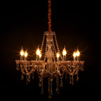 Maison Ornate 8-arm crystal chandelier with glass accents, candle bulbs, and decorative chains.