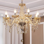 Maison Ornate K9 Crystal Chandelier with golden arms, crystal pendants, and six candle-style bulbs.