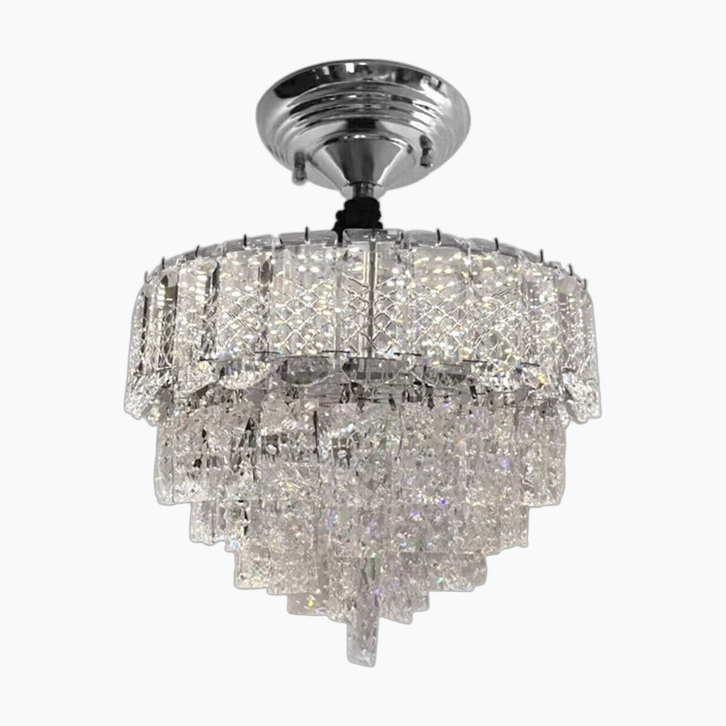 Chrome chandelier with tiered crystal prisms, ceiling-mounted, offering a sparkling, elegant statement.