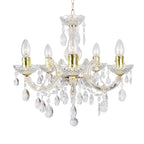 Brass and acrylic five-arm chandelier with candle bulbs, ornate curves, crystal pendants, chain hung.