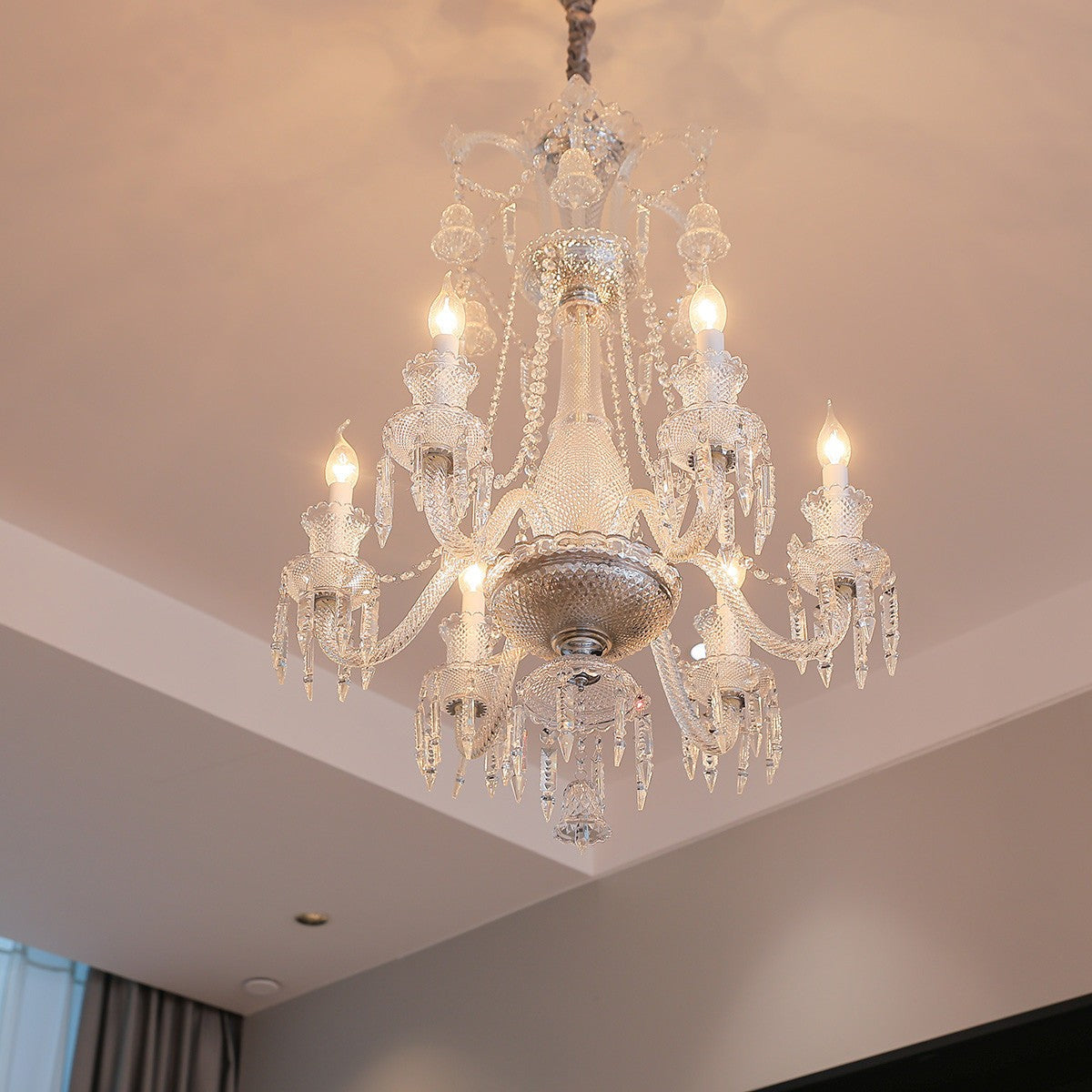 Maison Ornate Crystal Chandelier with 6/8/10 clear arms, lit bulbs, luxurious glass details.