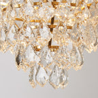 Luxurious gold crystal chandelier with intricate glass pendants reflecting warm light, elegant and eye-catching.